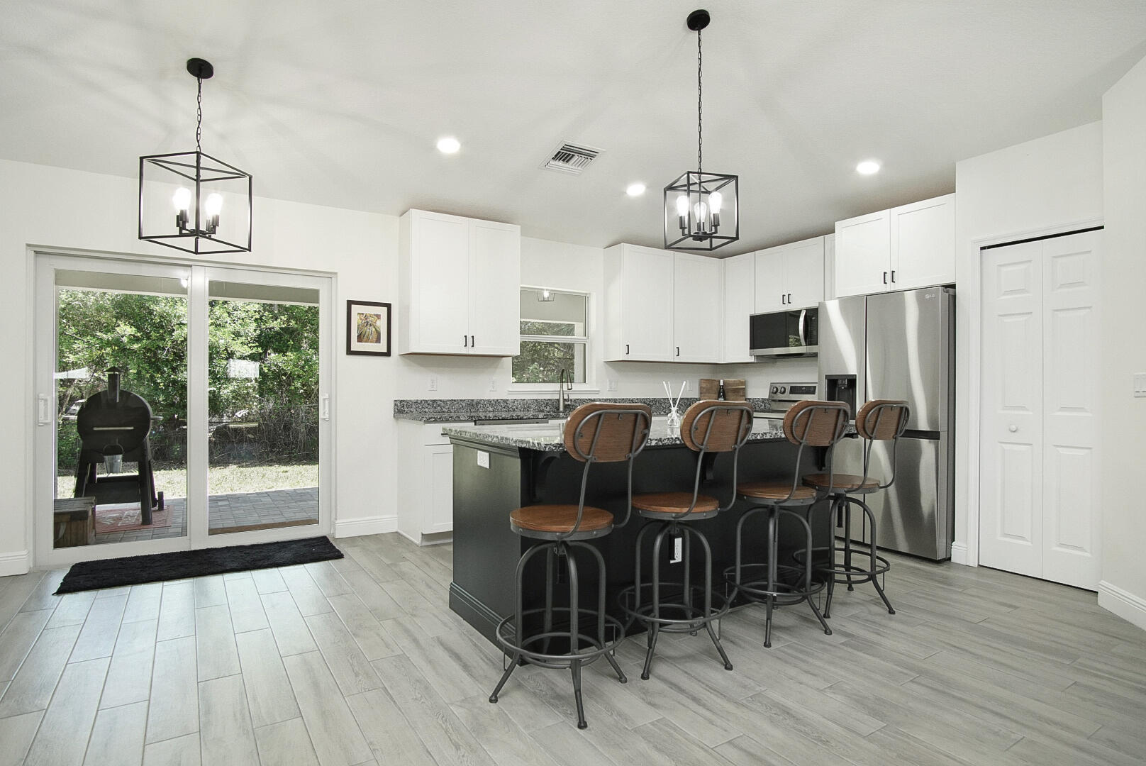 5302 Seagrape Drive Fort Pierce, FL 34982 - Photo 7 of 35 a view of a dining room with furniture window and wooden floor