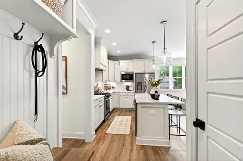 a kitchen with counter space appliances and windows