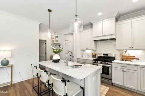 a view of a hallway with wooden floor and door