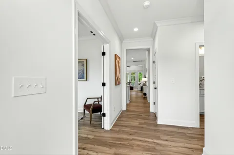 a view of an entryway with wooden floor