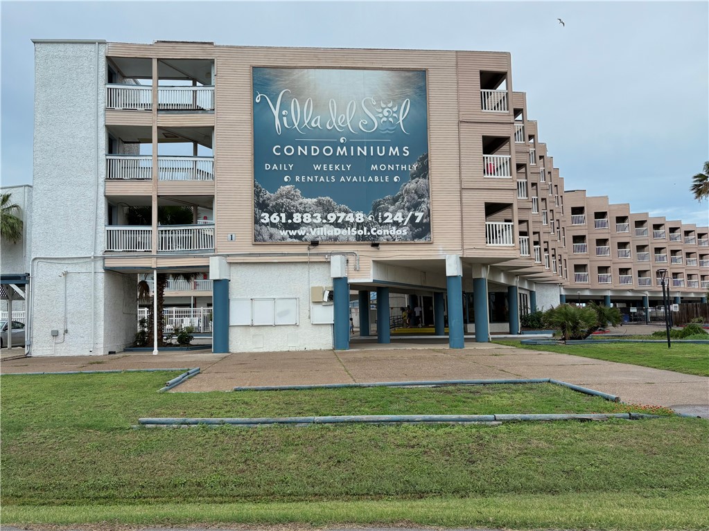 3938 Surfside, Unit 3233 Corpus Christi, TX 78402 - Photo 23 of 23 a front view of building with yard