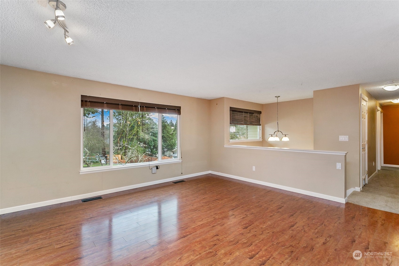 26007 36th Place South Kent, WA 98032 - Photo 16 of 37 a view of an empty room with wooden floor and a window