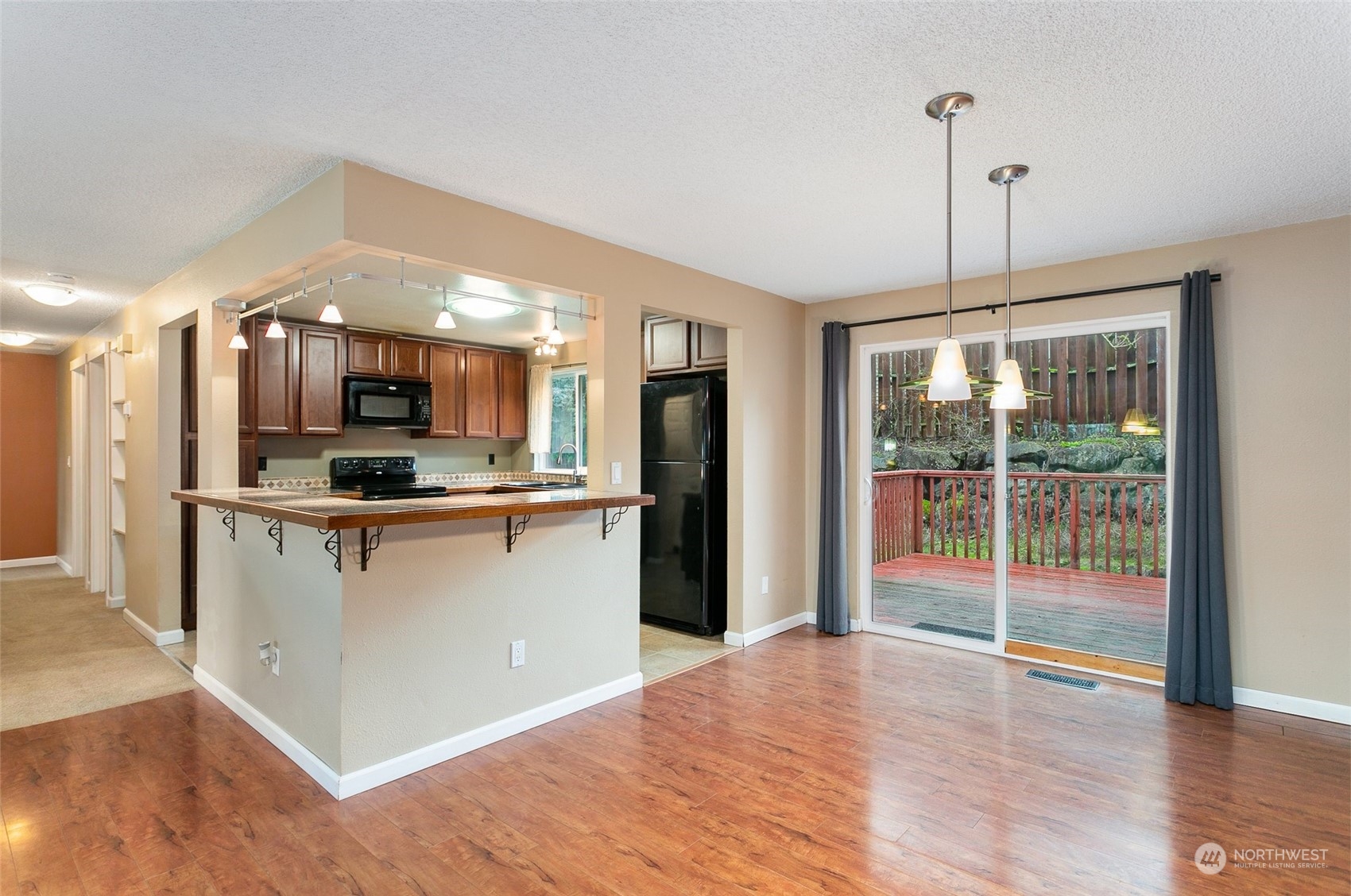 26007 36th Place South Kent, WA 98032 - Photo 5 of 37 a view of kitchen with refrigerator stove and wooden floor