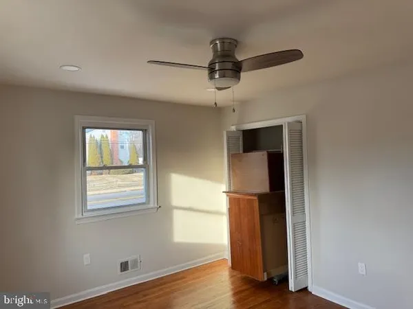 a view of a livingroom with wooden floor