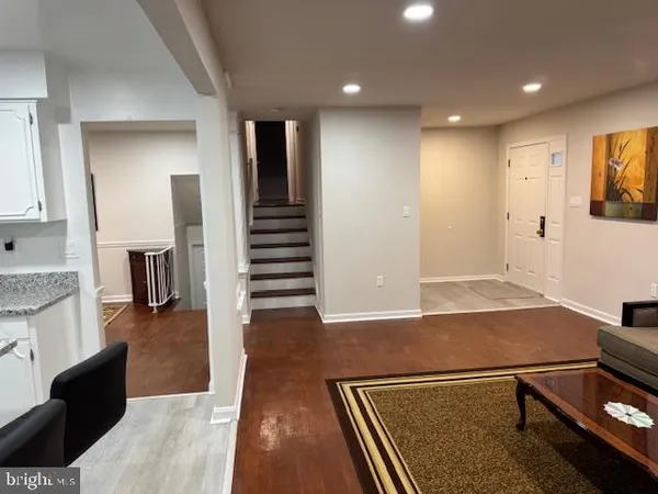 a kitchen with a table chairs stove and cabinets