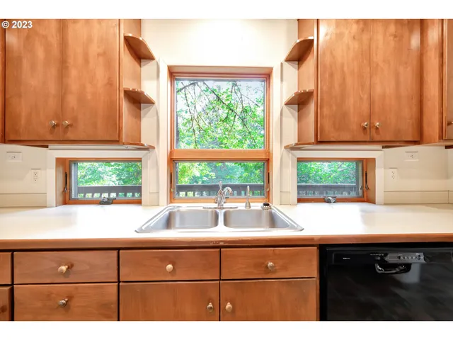 a large kitchen with a large window