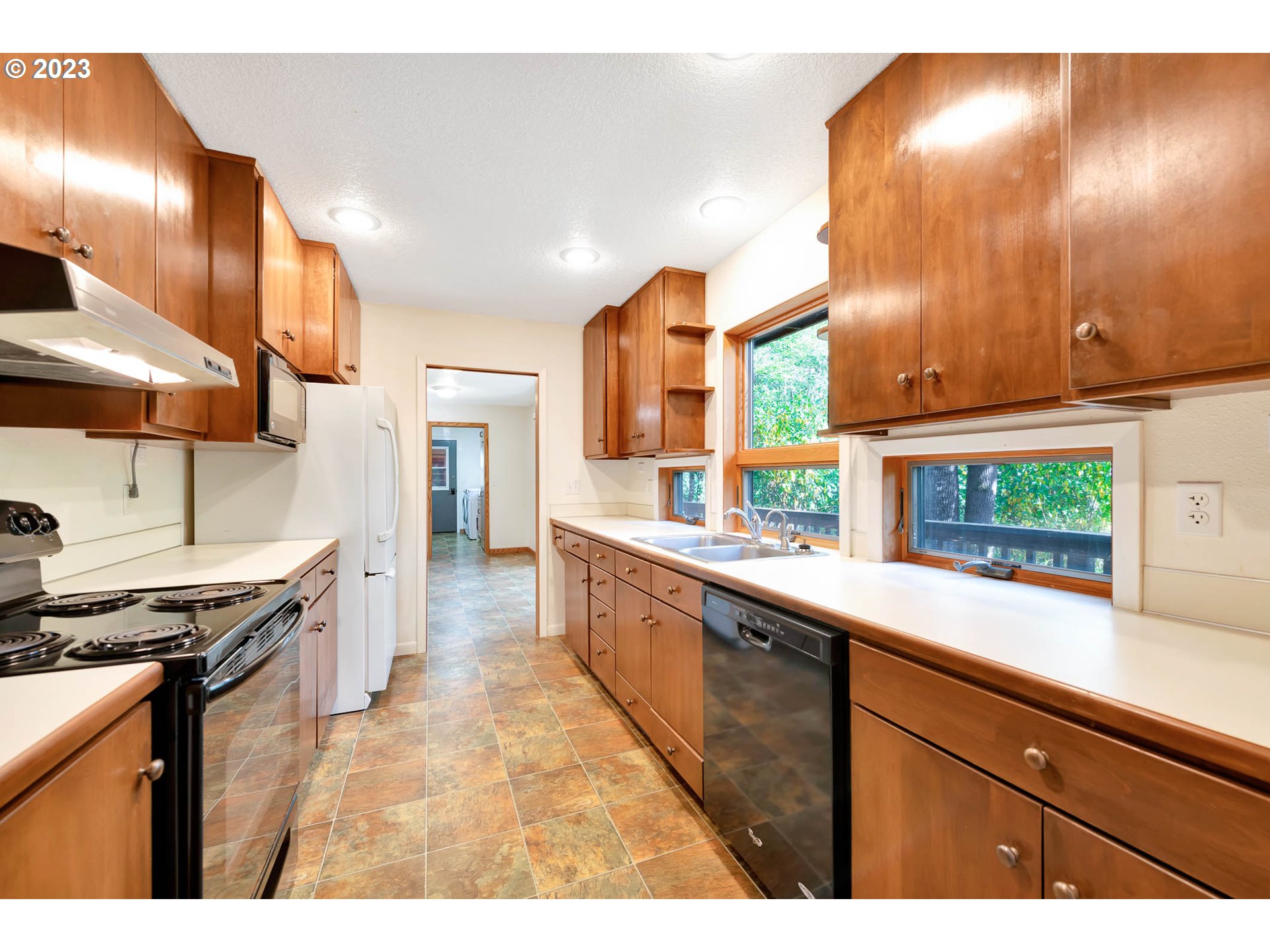 77383 Mosby Creek Road Cottage Grove, OR 97424 - Photo 14 of 48 a large kitchen with a large window
