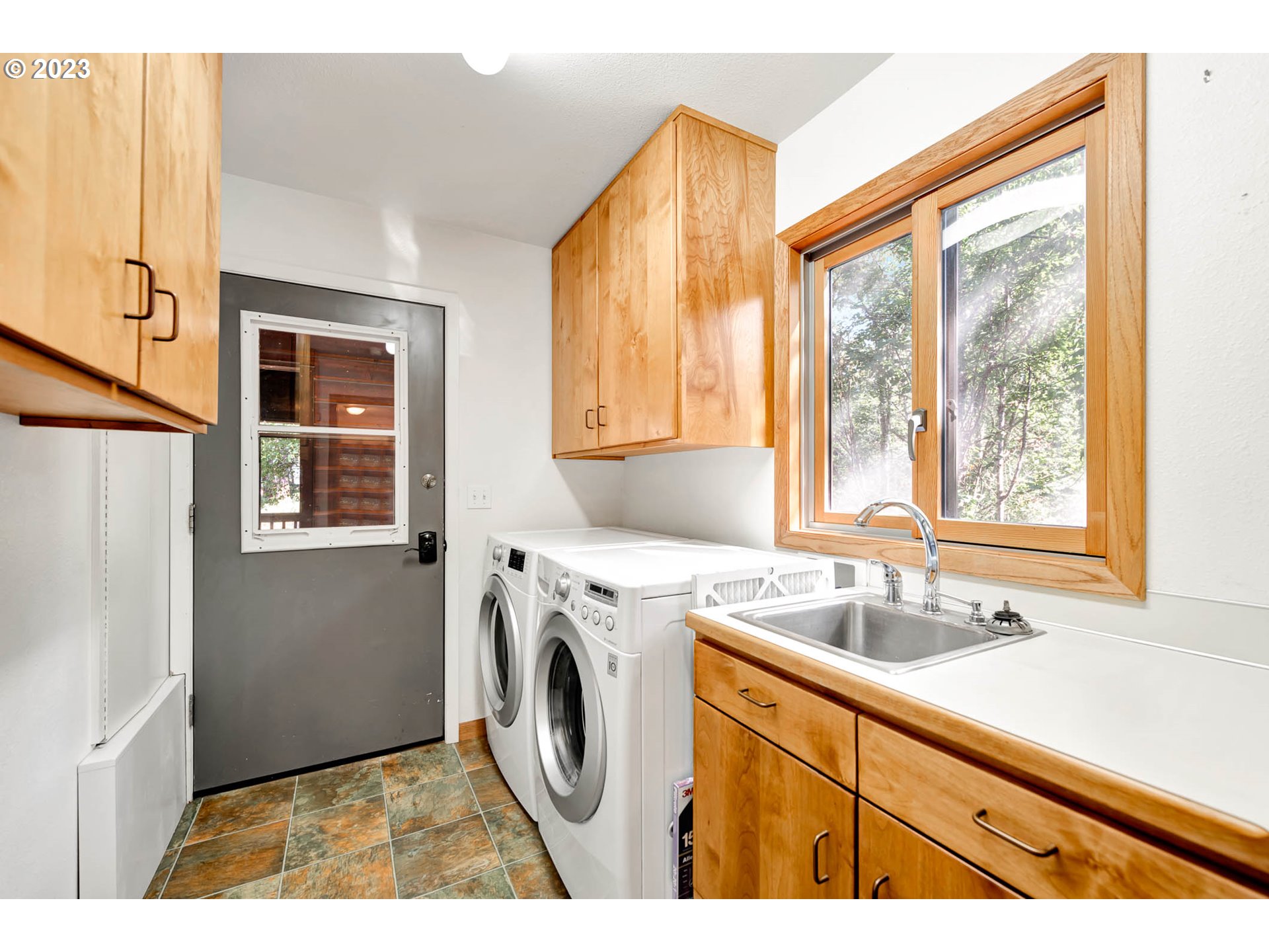 77383 Mosby Creek Road Cottage Grove, OR 97424 - Photo 17 of 48 a utility room with dryer and washer