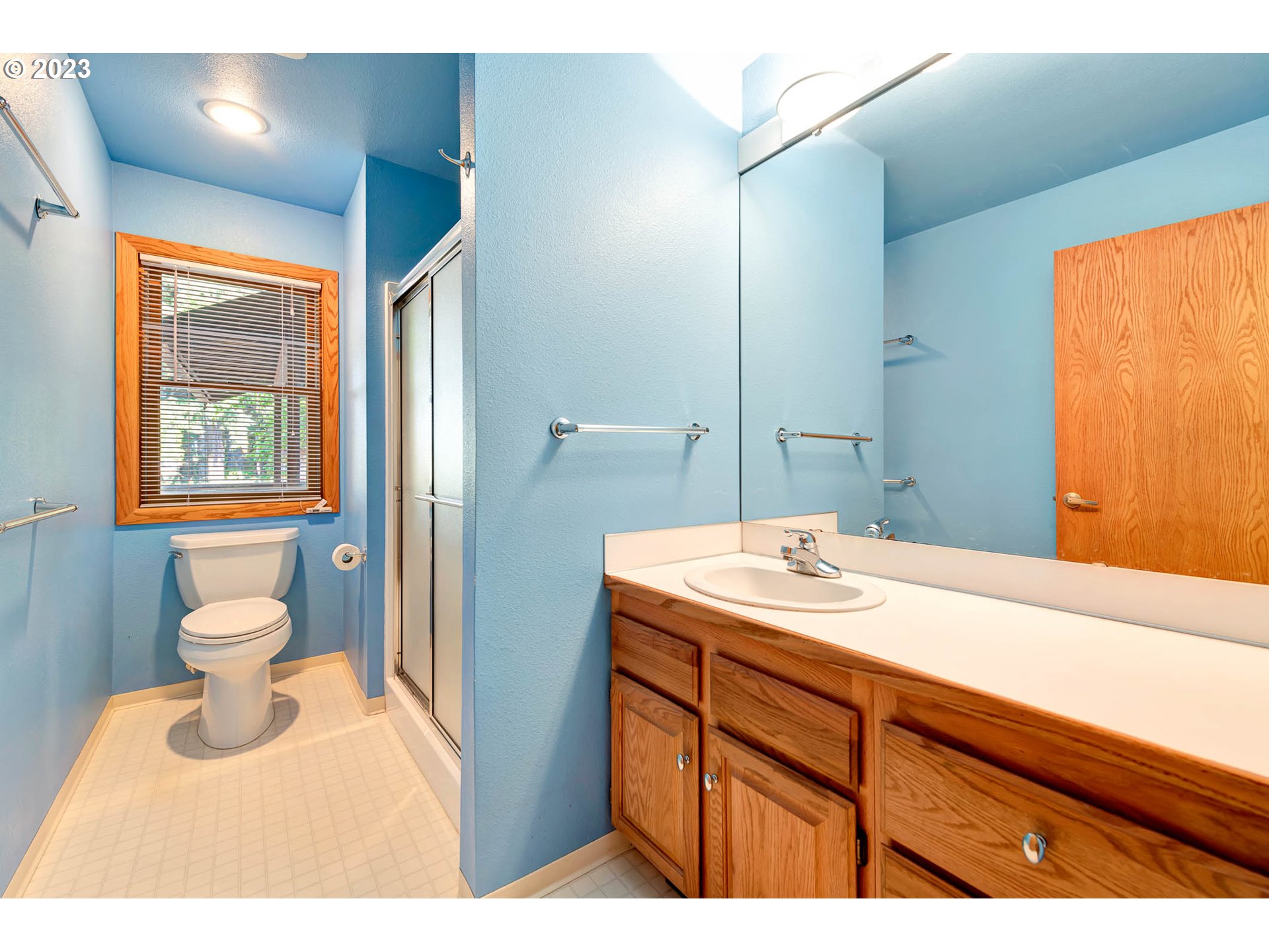 77383 Mosby Creek Road Cottage Grove, OR 97424 - Photo 19 of 48 a bathroom with a sink and a mirror
