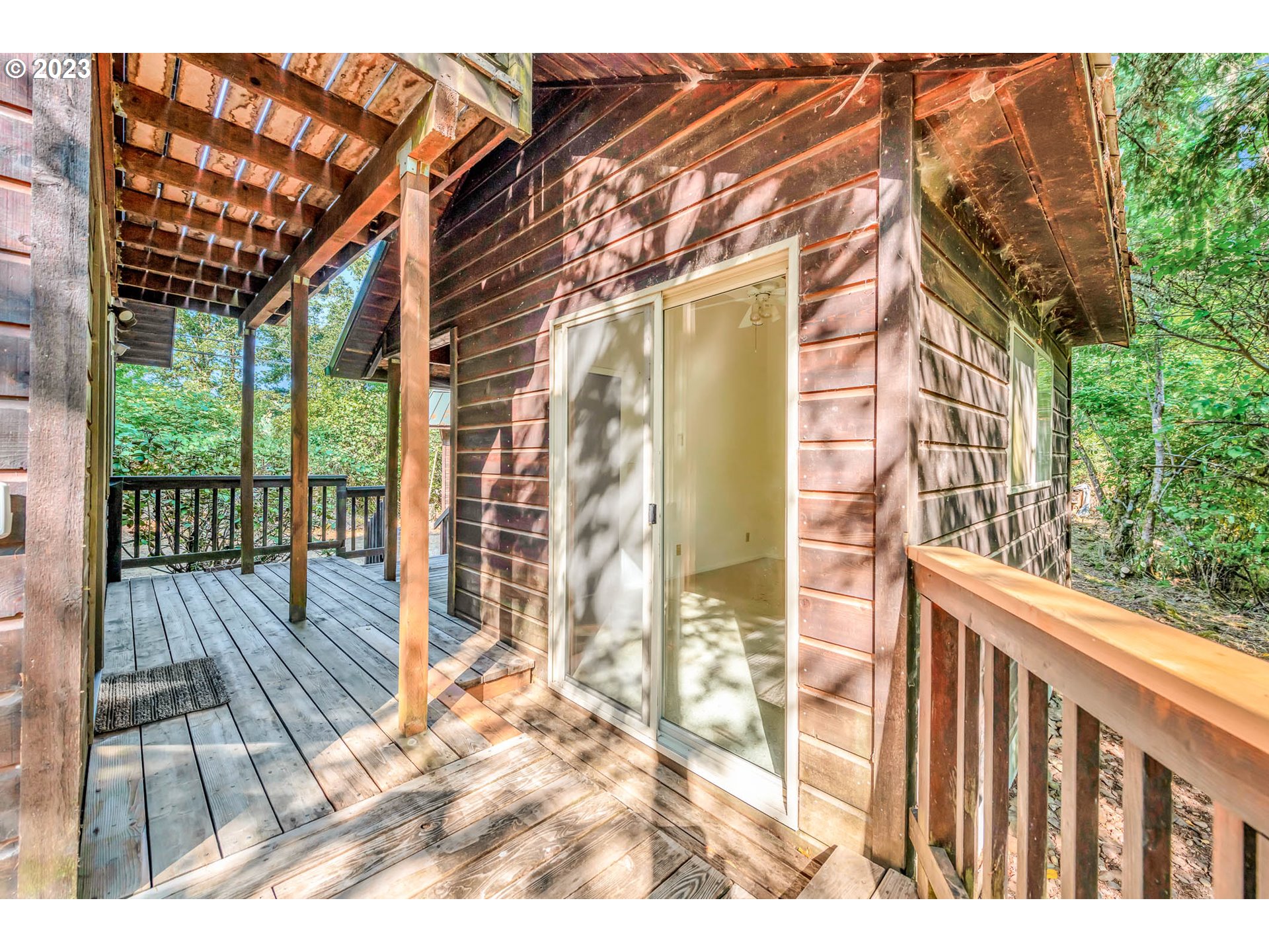 77383 Mosby Creek Road Cottage Grove, OR 97424 - Photo 30 of 48 a view of balcony with wooden floor and fence