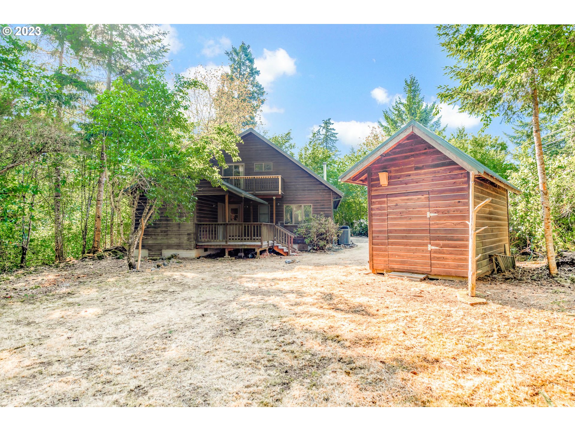 77383 Mosby Creek Road Cottage Grove, OR 97424 - Photo 38 of 48 a view of a house with a yard