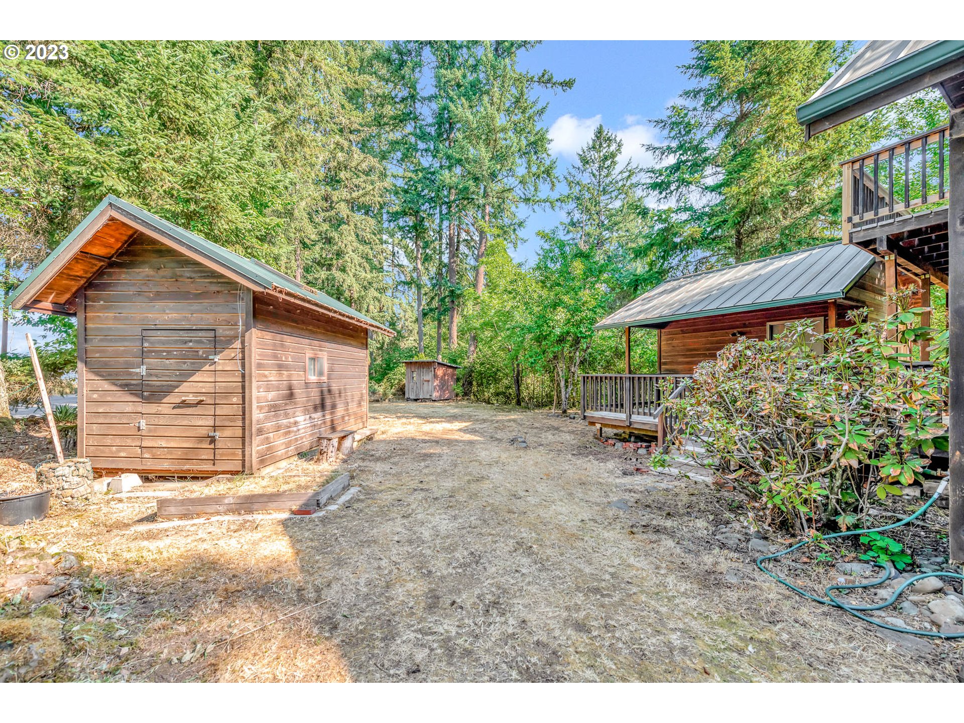 77383 Mosby Creek Road Cottage Grove, OR 97424 - Photo 39 of 48 a view of a house with a yard