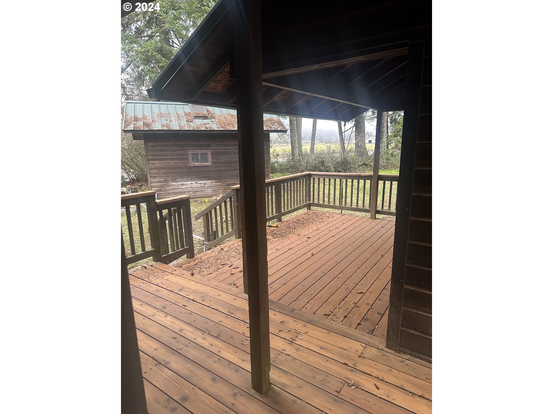 77383 Mosby Creek Road Cottage Grove, OR 97424 - Photo 47 of 48 a bed sitting in a bedroom next to a window