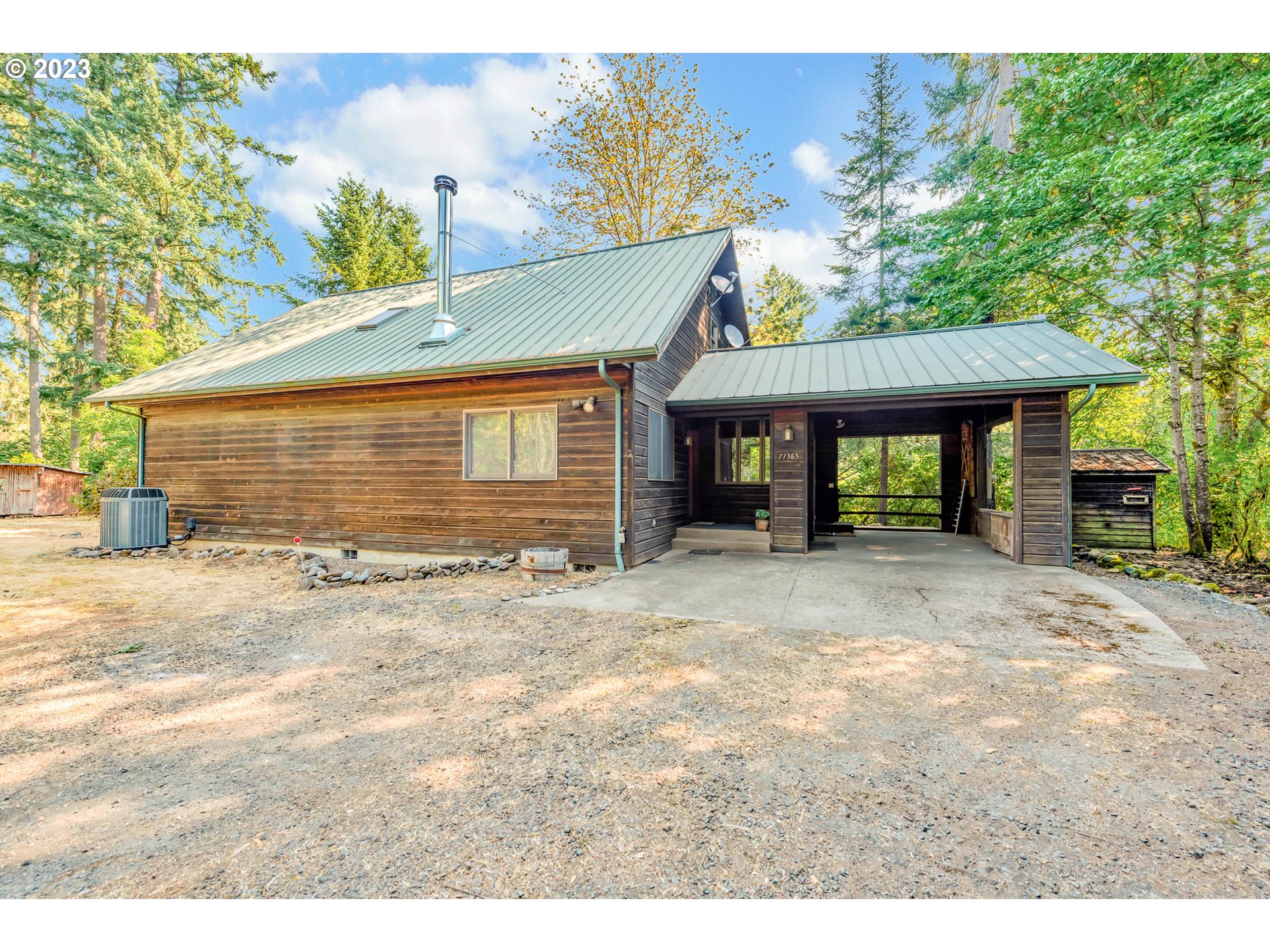 77383 Mosby Creek Road Cottage Grove, OR 97424 - Photo 5 of 48 a front view of a house with a yard