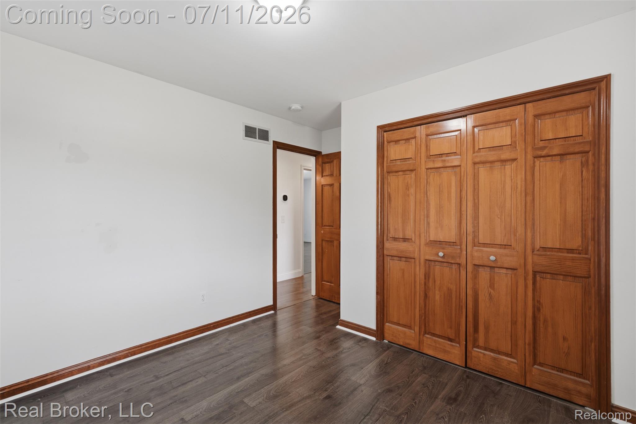1050 West Brocker Road Metamora, MI 48455 - Photo 25 of 55 Interior room featuring dark wood-finish flooring and white walls