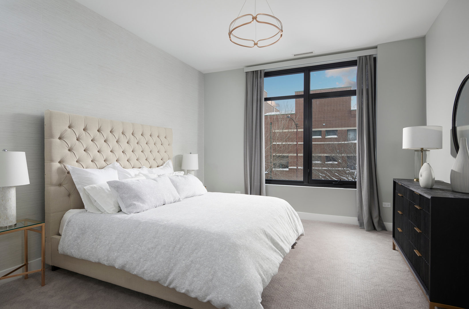 6 North Bishop Street, Unit 203 Chicago, IL 60607 - Photo 11 of 17 a large bed sitting in a bedroom next to a window