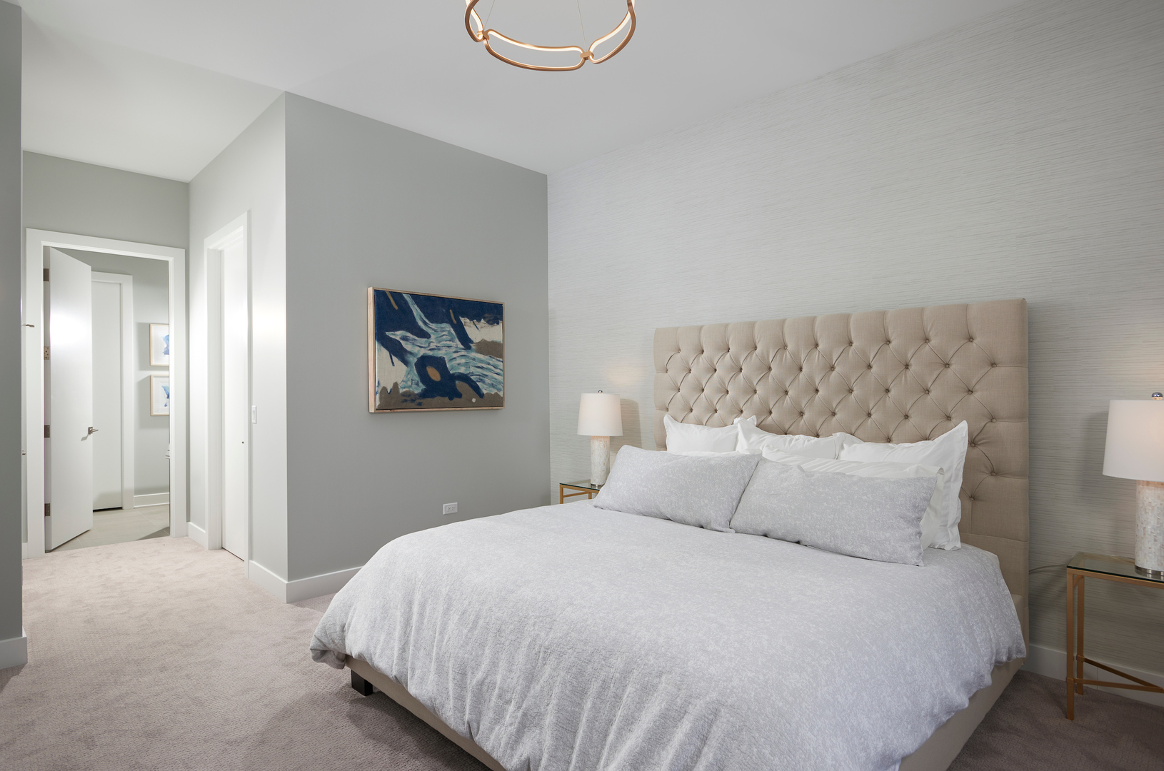 6 North Bishop Street, Unit 203 Chicago, IL 60607 - Photo 12 of 17 a bedroom with a bed and painting on the wall