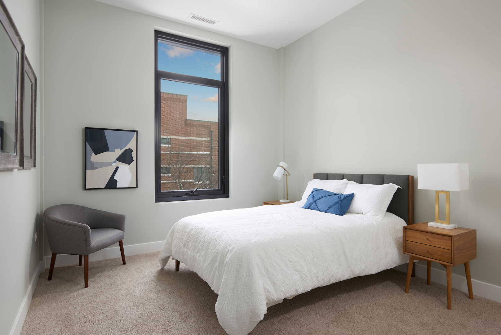 6 North Bishop Street, Unit 203 Chicago, IL 60607 - Photo 13 of 17 a bedroom with a bed and a chair