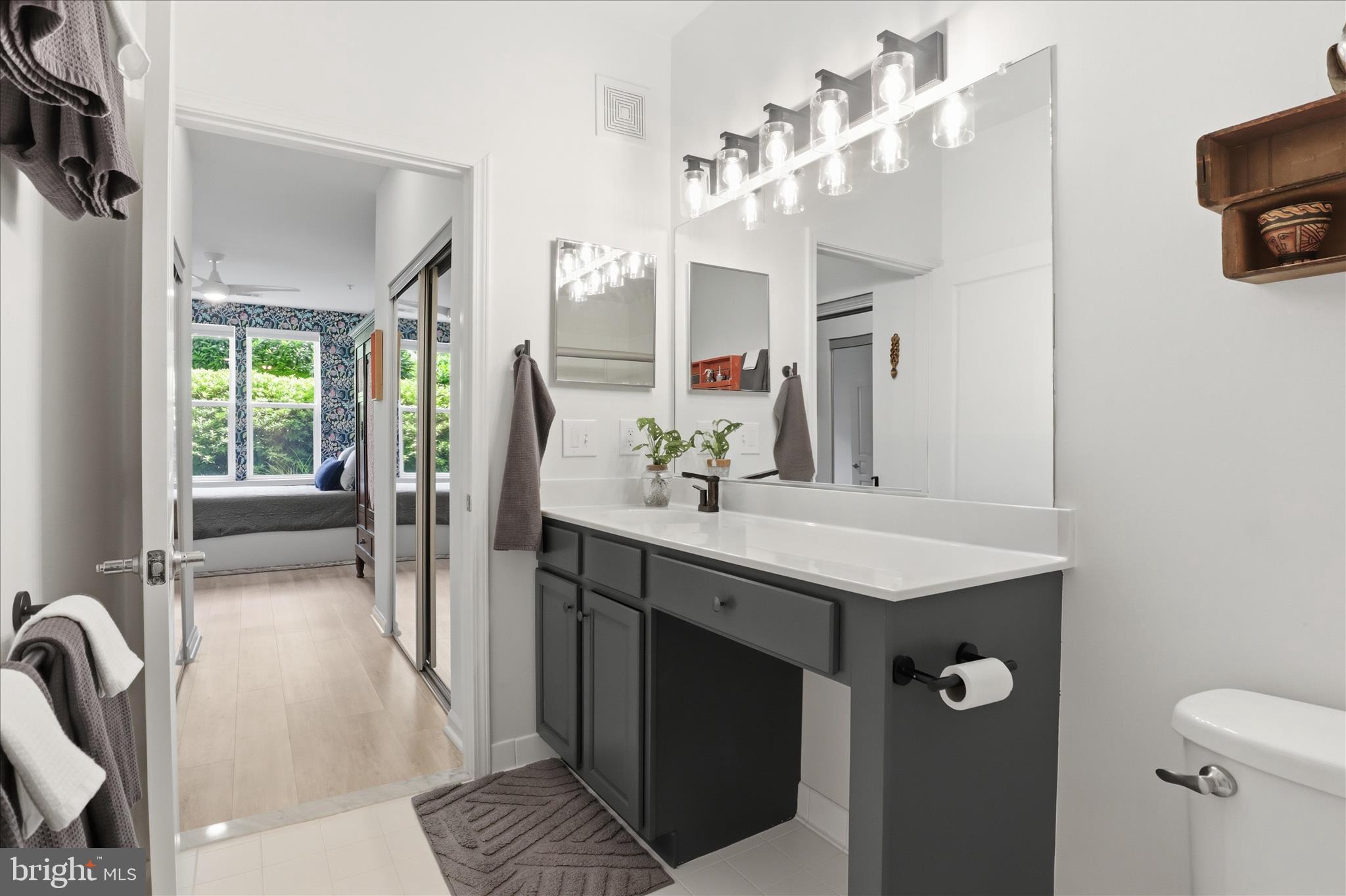 12001 Market Street, Unit 177 Reston, VA 20190 - Photo 17 of 63 Primary Bathroom with new lighting and hardware
