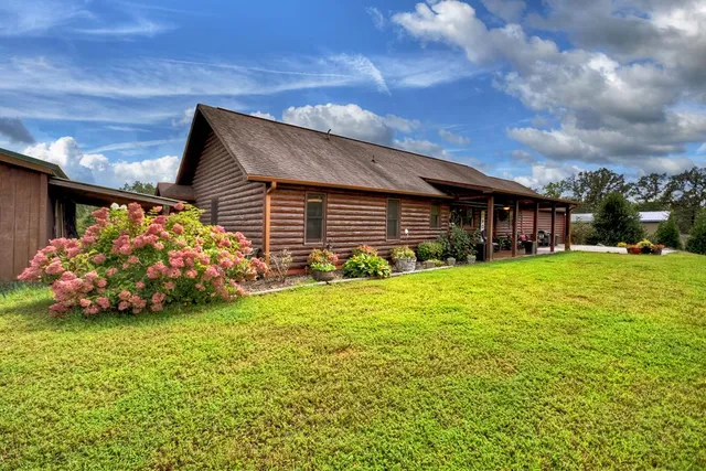 a front view of house with garden