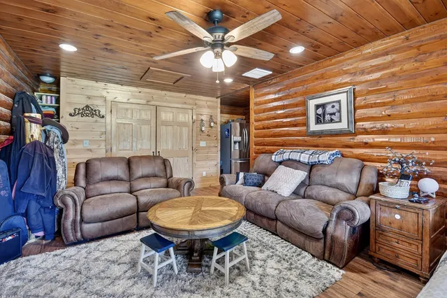 a work room with furniture and a rug