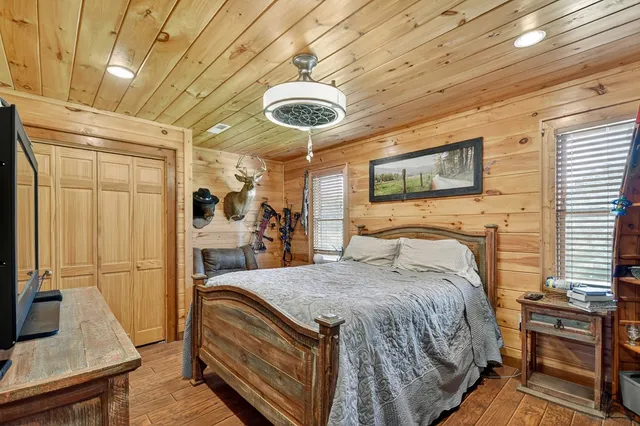 a bed room with a bed and a flat screen tv