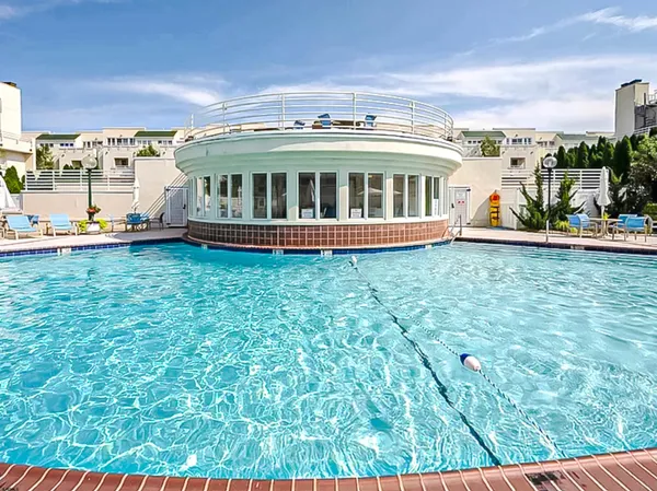 a view of swimming pool from a balcony