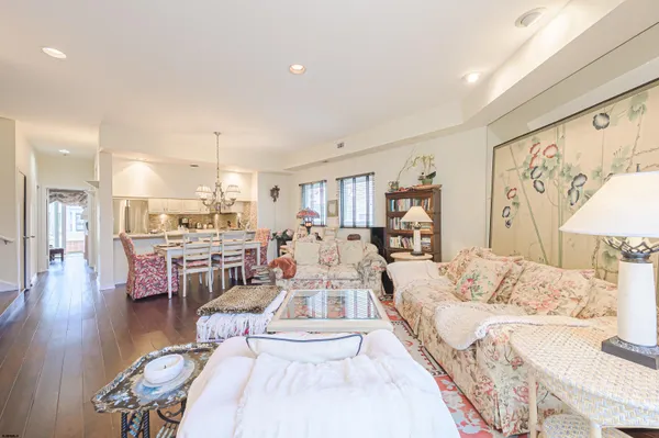 a large room with a lot of white furniture