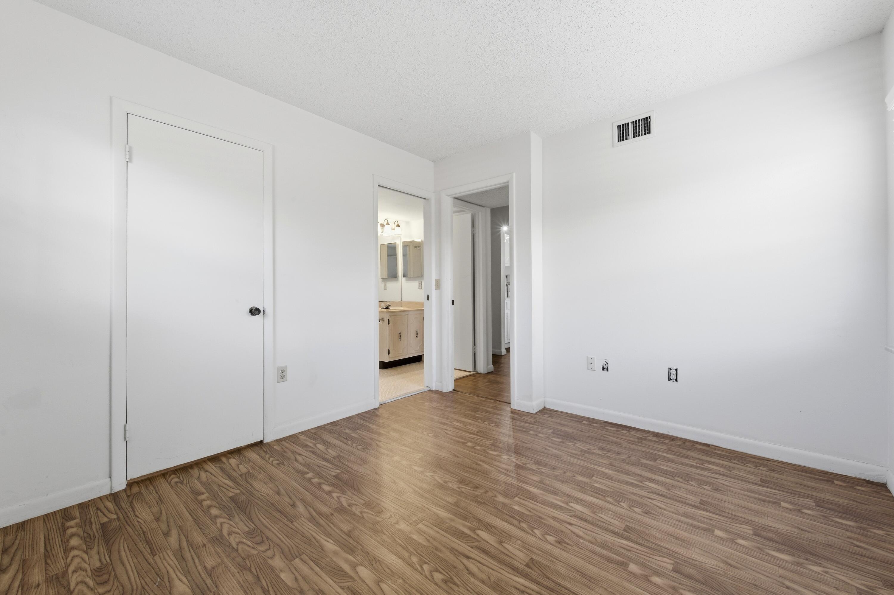 717 Highway 1, Unit 201 Jupiter, FL 33477 - Photo 14 of 31 a view of an empty room with wooden floor