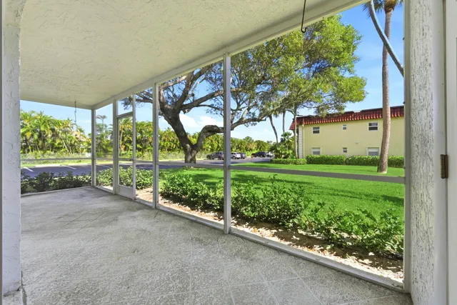 a view of a garden with an outdoor seating