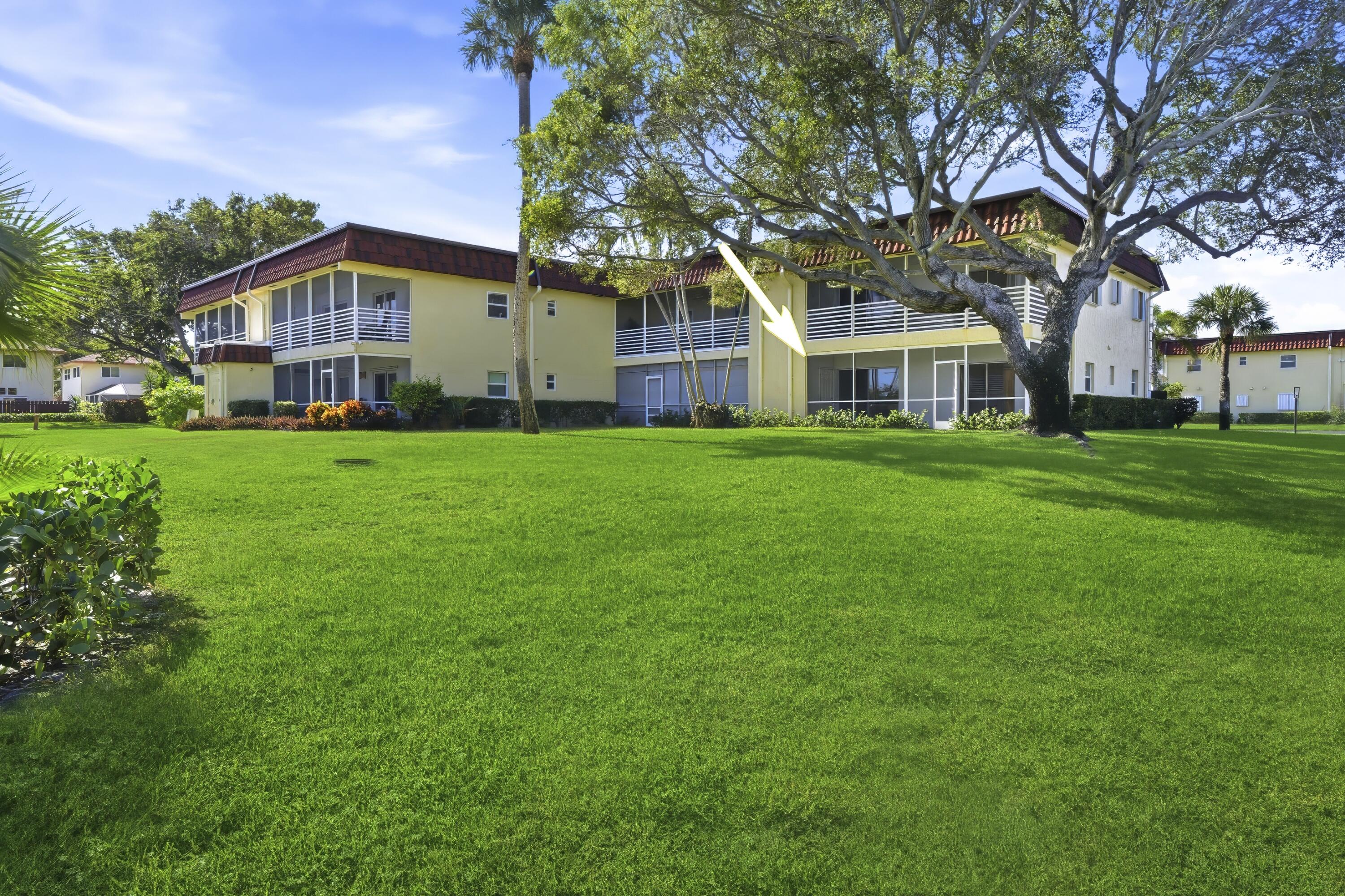 717 Highway 1, Unit 201 Jupiter, FL 33477 - Photo 17 of 31 a front view of house with yard and green space