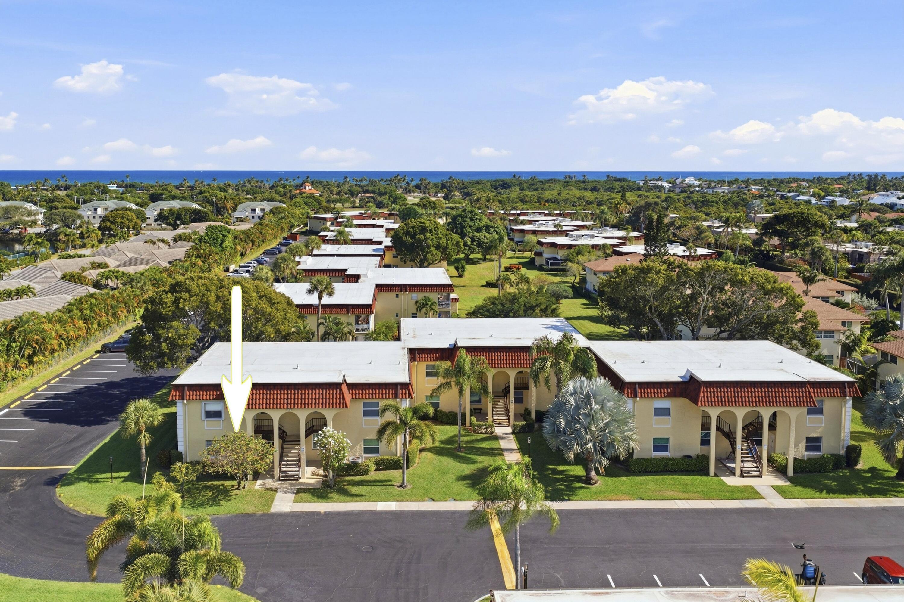 717 Highway 1, Unit 201 Jupiter, FL 33477 - Photo 19 of 31 an aerial view of residential houses with outdoor space and parking
