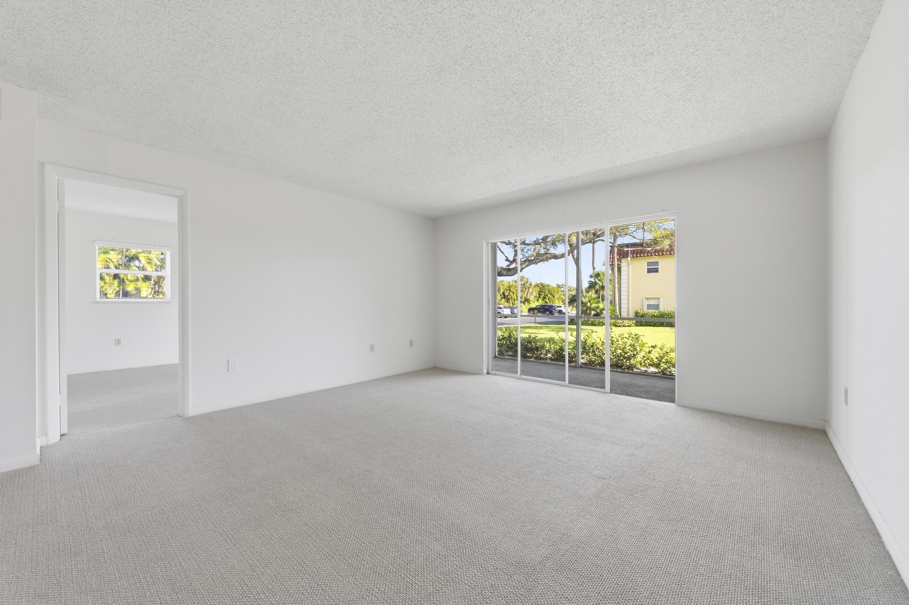 717 Highway 1, Unit 201 Jupiter, FL 33477 - Photo 6 of 31 a view of an empty room with a window