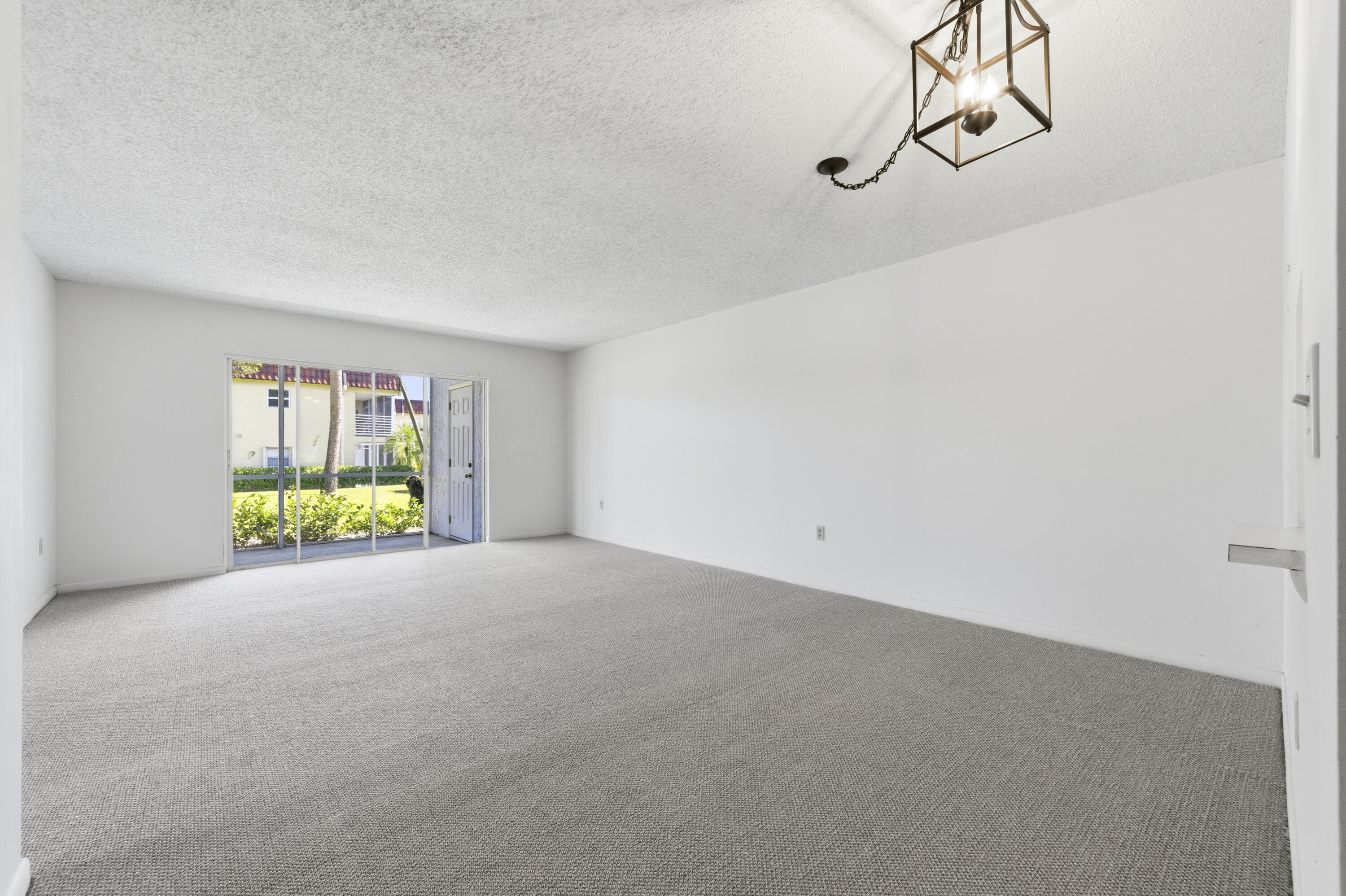 717 Highway 1, Unit 201 Jupiter, FL 33477 - Photo 8 of 31 a view of an empty room with windows