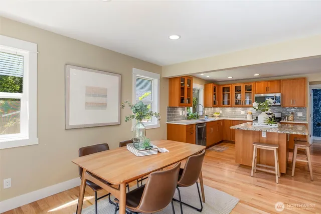 a dining room with a table and chairs