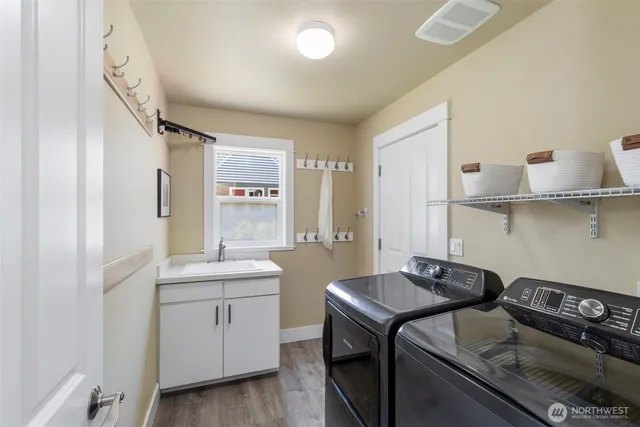 a kitchen that has a sink and a stove
