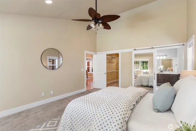 a bedroom with bed and a window