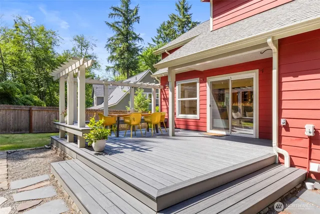 a wooden bench sitting in front of a building