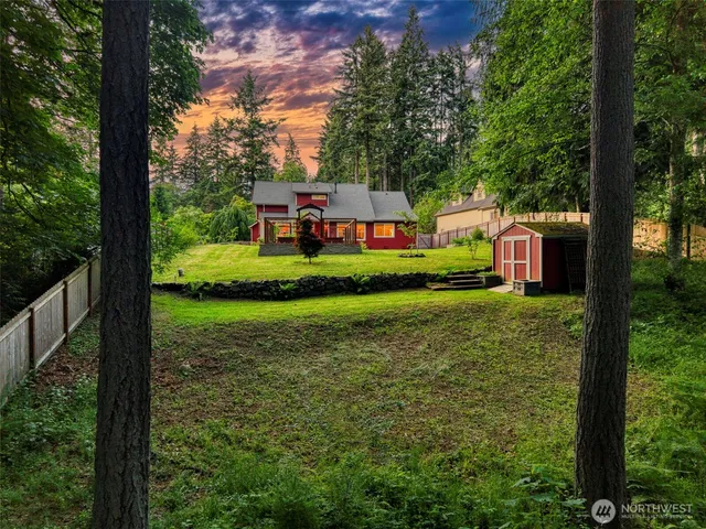 a front view of a house with a yard table and chairs
