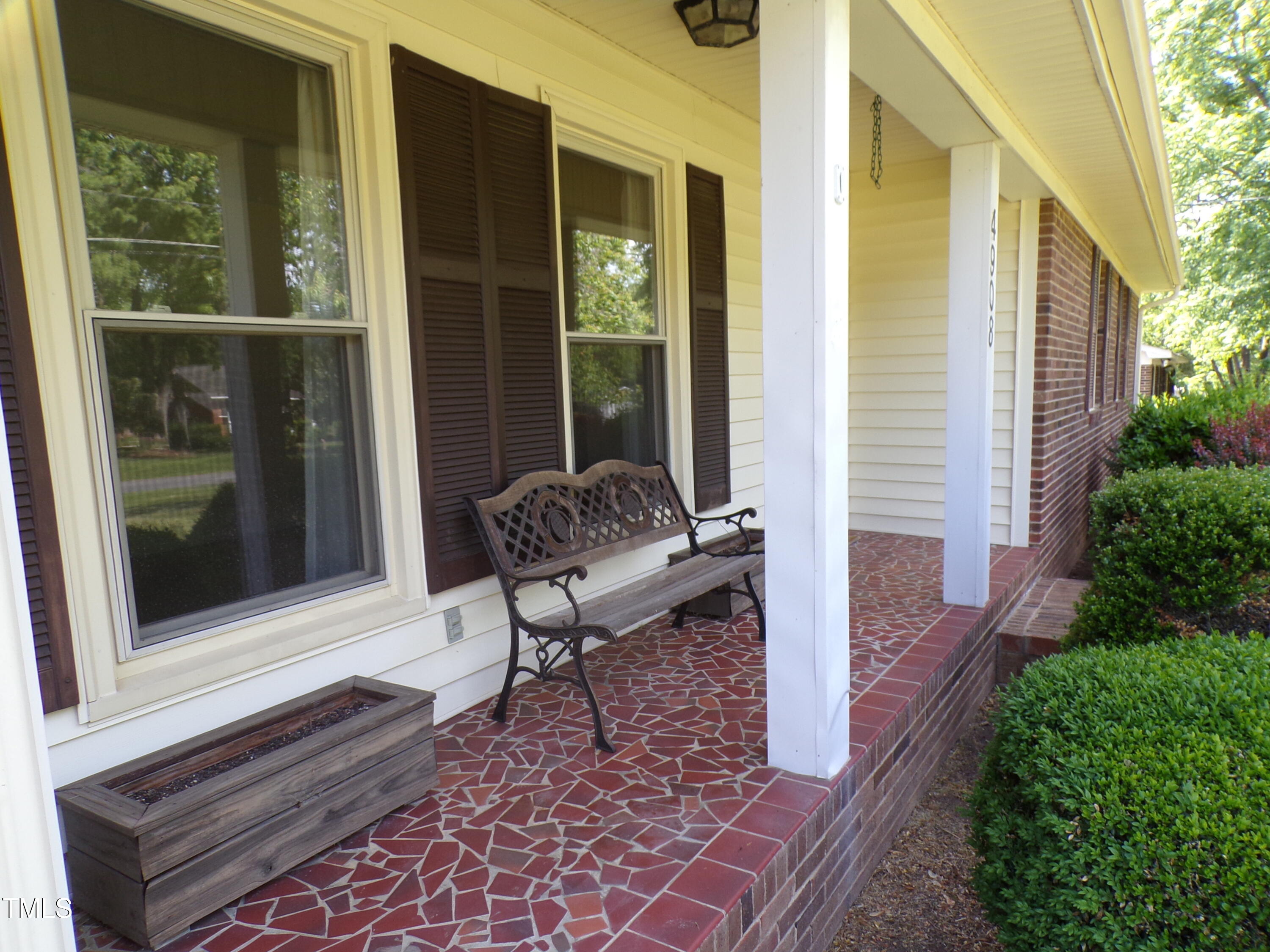 4908 Mandel Road Durham, NC 27712 - Photo 16 of 31 Relax on the cracked tile front porch!