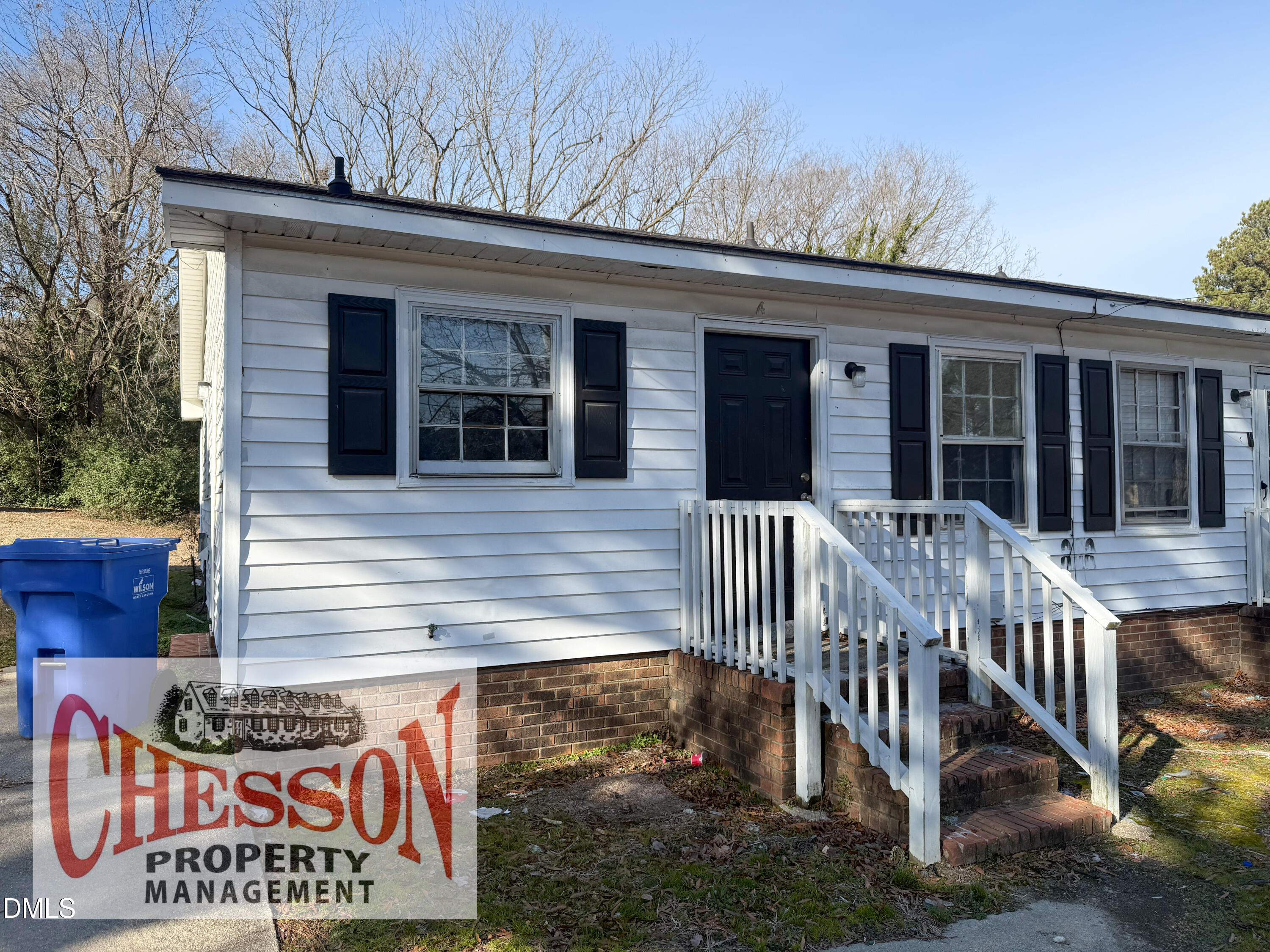 808 Crawford Street South Wilson, NC 27893 - Photo 1 of 11 a view of a house with a small yard and wooden floor and fence