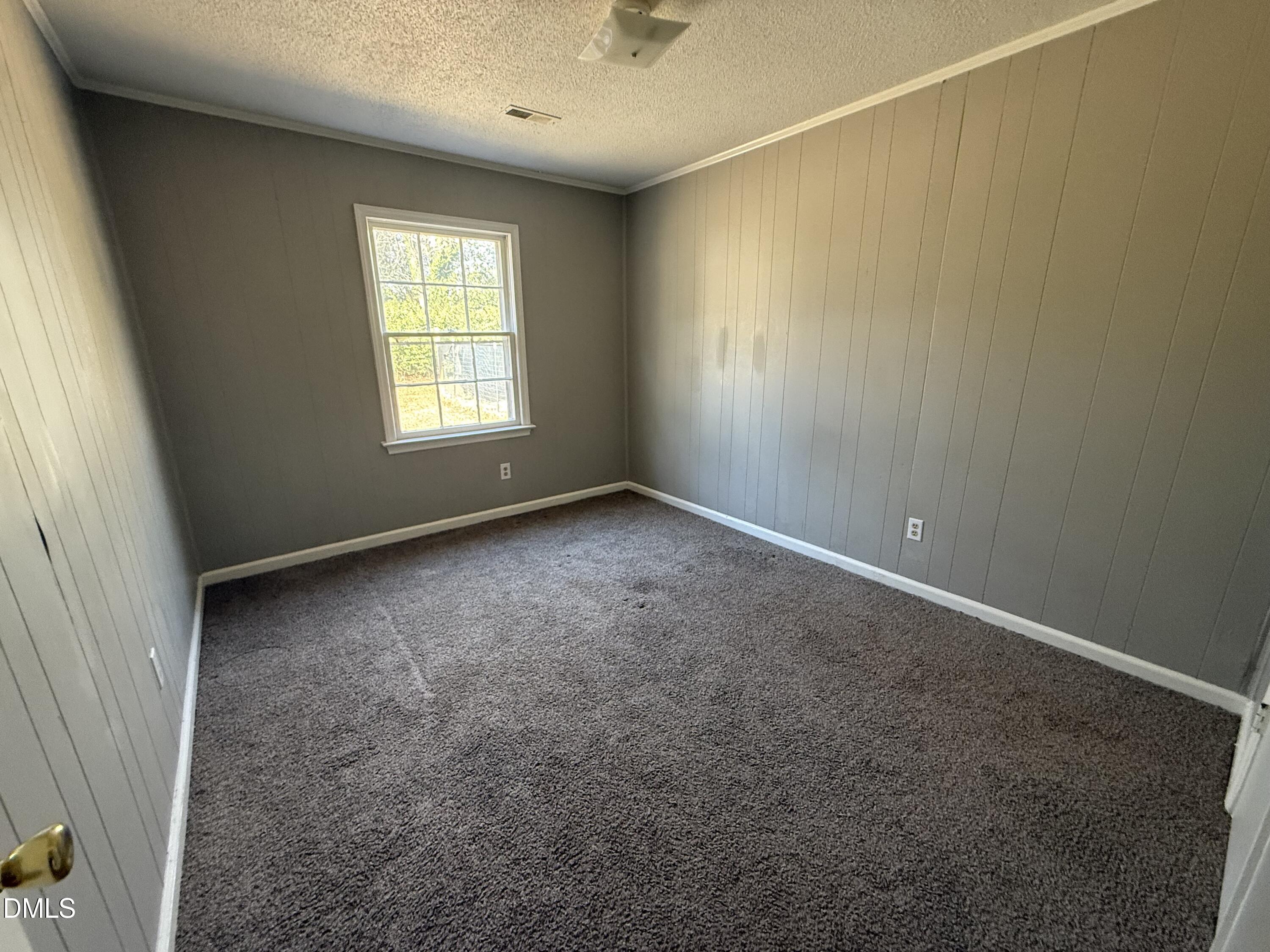 808 Crawford Street South Wilson, NC 27893 - Photo 7 of 11 an empty room with windows