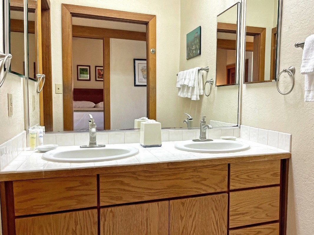 2253 Poipu Road, Unit 317 Koloa, HI 96756 - Photo 15 of 16 a bathroom with a sink and a mirror