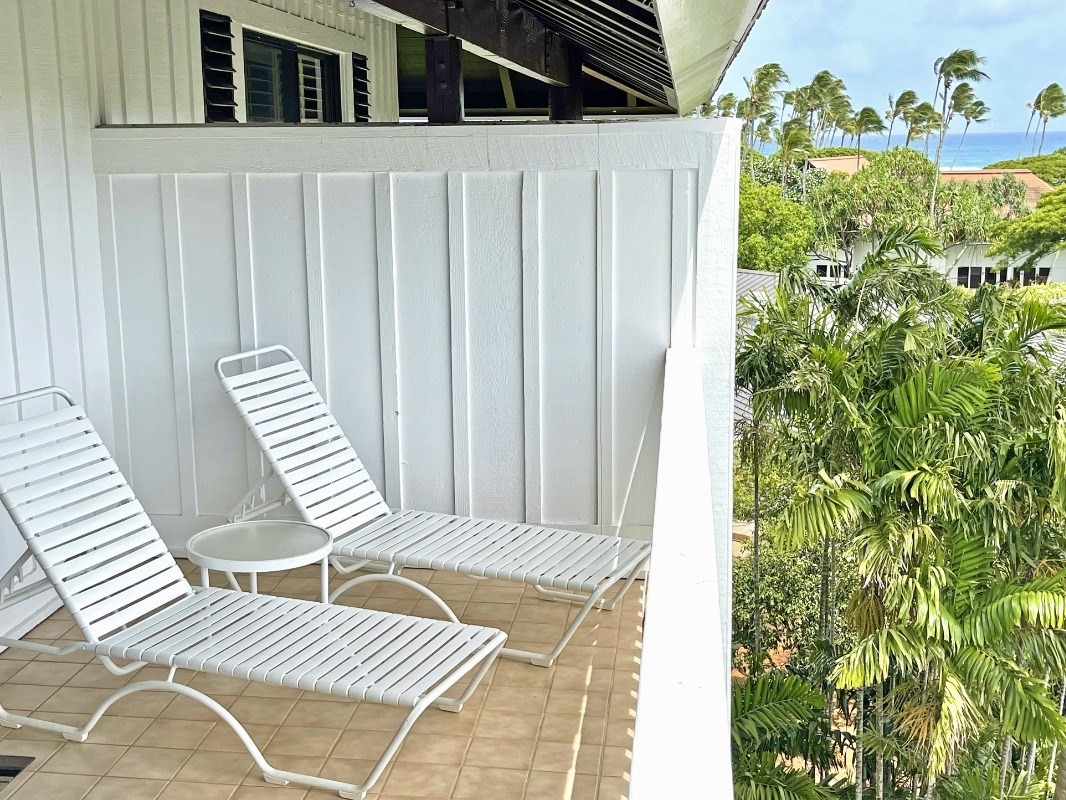2253 Poipu Road, Unit 317 Koloa, HI 96756 - Photo 2 of 16 a balcony with table and chairs