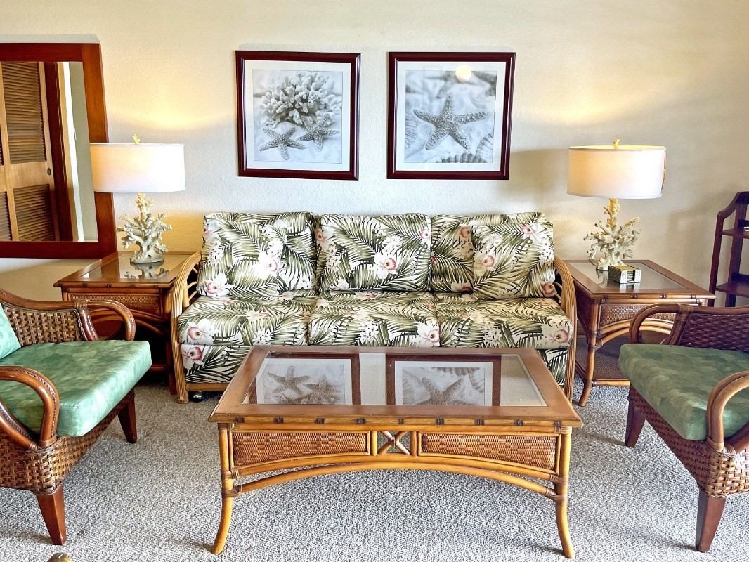2253 Poipu Road, Unit 317 Koloa, HI 96756 - Photo 8 of 16 a living room with furniture and a lamp