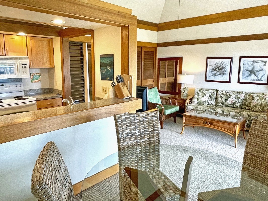 2253 Poipu Road, Unit 317 Koloa, HI 96756 - Photo 10 of 16 a living room with furniture and floor to ceiling windows