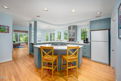 a view of kitchen island with furniture and wooden floor