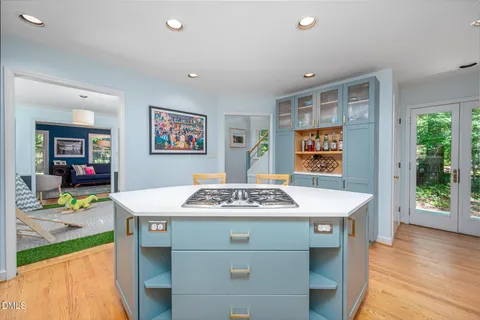 a kitchen with a sink stove and microwave