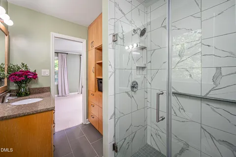 a bedroom with a bed and a table in it