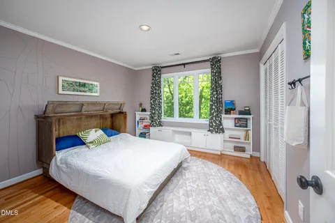 a bedroom with furniture and a window